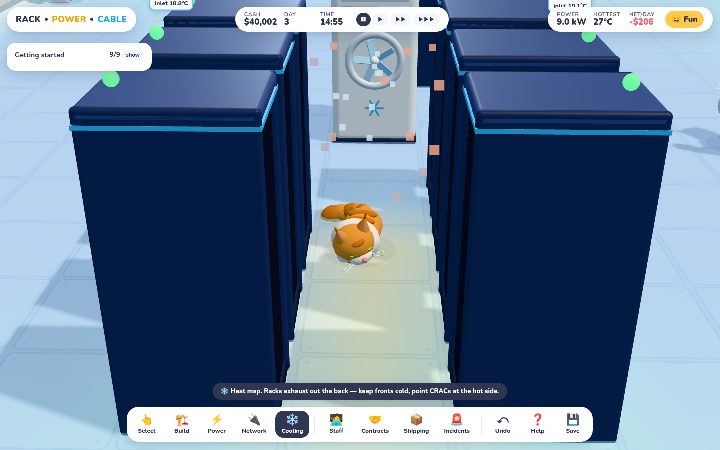 Looking down a hot aisle between two rows of navy racks with the cooling overlay on: an orange Maine Coon is curled up asleep on a glowing yellow warm patch, with a CRAC unit at the far end.